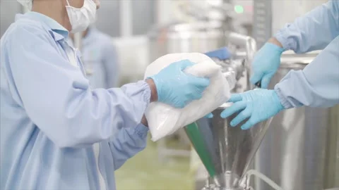 Scientist process ingredients into machinery. Stock Footage 159722724