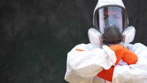 Scientist in a protective clothes standing together with arms crossed Vídeos de archivo 147145547