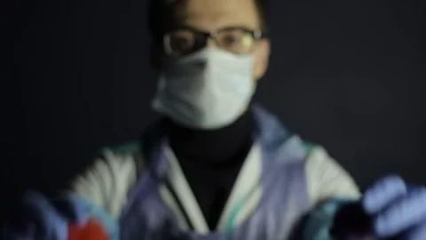 A scientist in protective clothing pointing to the camera two coronavirus COVID 스톡 동영상 126976939