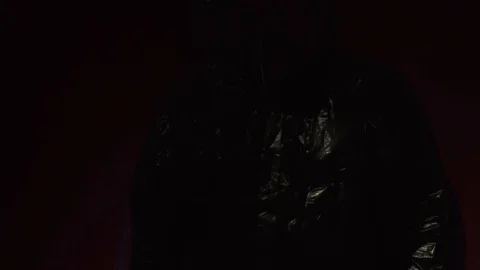 Scientist in protective suit on dark red background. Coronavirus protection Stock-Footage 127117661