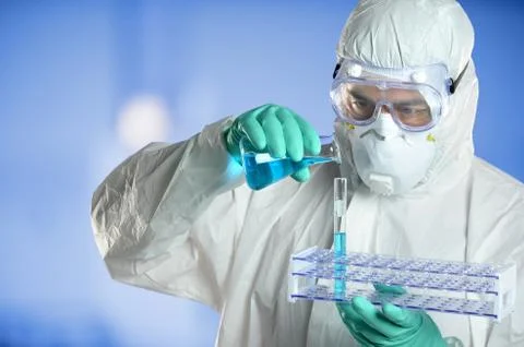 Scientist in Protective Suit in Lab Stock Photos