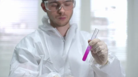 Scientist in protective workwear shake tube with chemical the laboratory Stock Footage 123671902