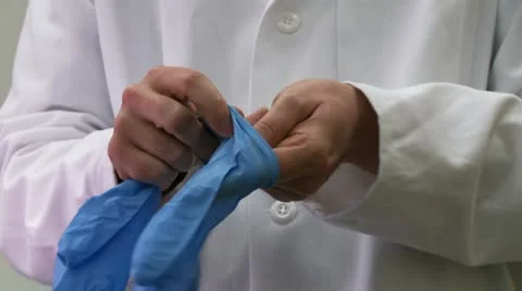 Scientist puts on Safety Gloves Stock Footage 22793668