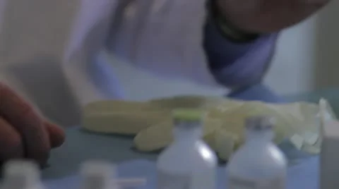 Scientist putting on rubber gloves Stock Footage 20446356