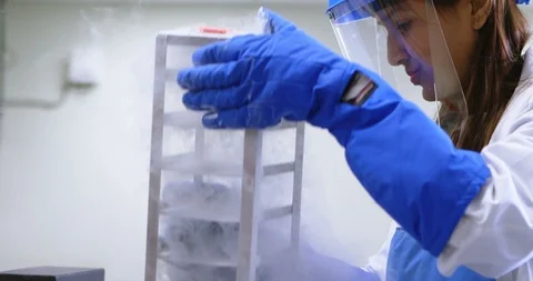 Scientist removing vertical freezer rack... | Stock Video | Pond5