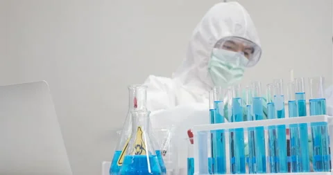 Scientist researcher using microscope with using a tablet in laboratory Stock Footage 133085657