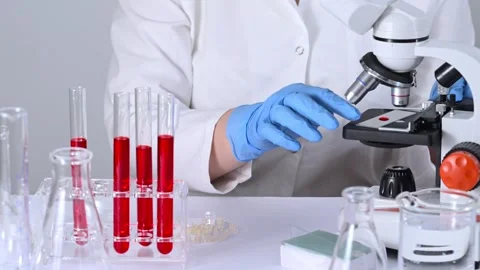 Scientist researching blood sample under microscope. Video stock 271272038