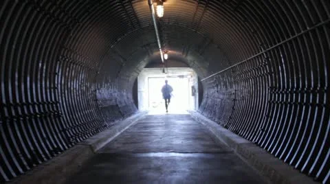 Scientist Running Down an Ominous Corridor - Steadycam Video stock 22385299