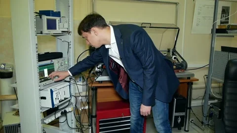 Scientist sets up work of special crash tester. Stock Footage 167830857