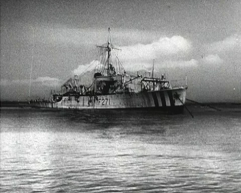 Scientist setting up device on board of battleship, Australia 1952 Stock Footage 133370032