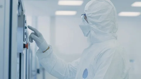 Scientist Setting Programme on Semiconductor Factory Machine Stock Footage 93227452