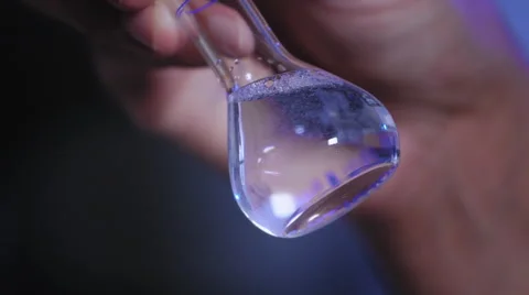 Scientist shaking a test tube for an experiment Stock Footage 57768363