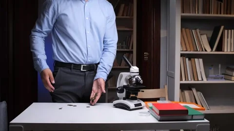 Scientist showing empty pockets in his laboratory after funding cuts Stock Footage 314082981