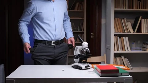 Scientist showing empty pockets in his office after funding cuts Video stock 314082988