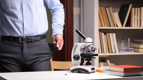 Scientist showing empty pockets in laboratory after funding cuts Stock Footage 313083614