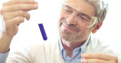 A scientist showing the water hardness test tubes,he shows thumb up 스톡 동영상 48973464