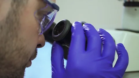 Scientist spin adjusting microscope Spbd. male chemist face closeup. fixing Stock Footage 129525108