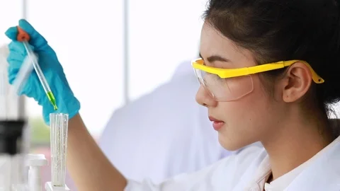 Scientist student mixing substances in test tube. Stock Footage 101229556