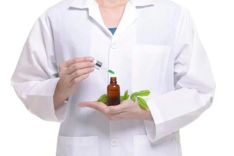 Scientist study and research liquid medicine from natural herbal. Stock Photos