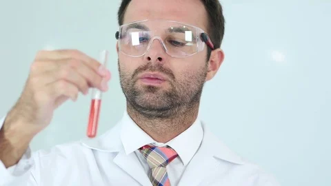 Scientist Studying red Solution in Test Tube in Laboratory Stock Footage 81165610