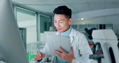 Scientist, tablet and computer for research, data analysis and typing test Stock Footage 250964134
