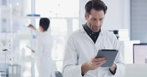 Scientist with tablet, science and research in laboratory, man with technology Stock Footage 222063746