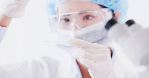 Scientist take microscope slide Stockbeeldmateriaal 96218038