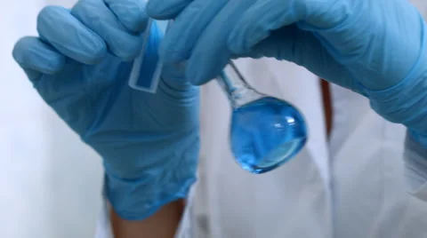 Scientist take sample liquid in flask Stock-Footage 52060718