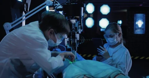 Scientist takes a sample of the material of the alien. There is an autopsy of a Stock Footage 102984264