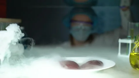 Scientist taking kidneys from fridge and injecting liquid, analyzing tissues Stock Footage 104995376