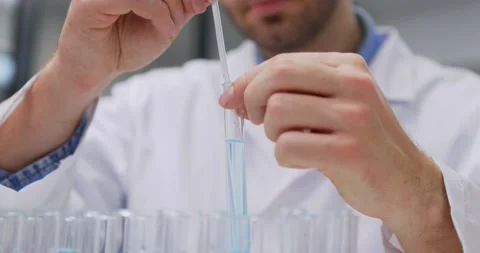 Scientist taking samples from tubes in the laboratory, uses Petri dish. Doctor Video stock 144639892