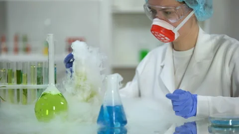 Scientist taking yellow liquid sample in pipette and checking sediment, petrol Stock Footage 103351522