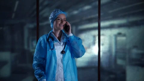 Scientist talking on the phone in the laboratory. Using Digital Device, High Stock Footage 95324558