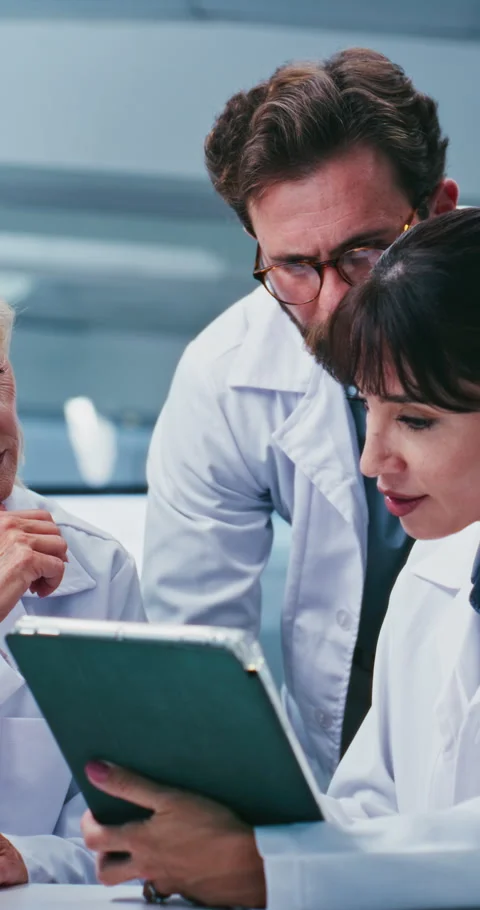 Scientist, team and tablet for report at laboratory with talk, feedback and Stock Footage 331583410
