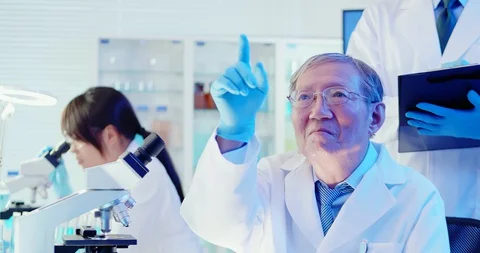 Scientist team press virtual button Stock Footage 129929933