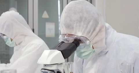 Scientist teamwork has researching on Coronavirus cure in the laboratory Stock Footage 133087080