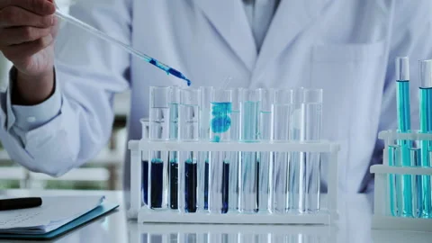 Scientist test for Covid-19 or Corona virus By using science tubes Stock Footage 137521744