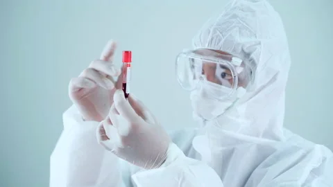 Scientist testing blood and virus in laboratory to produce vaccine to cure covid Stock Footage 146598479