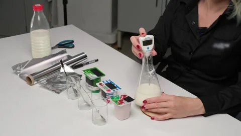 Scientist testing dairy products in laboratory Stock Footage 306322818