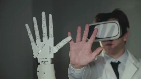 The scientist testing the robotic hand used vr glasses in the lab. 4K Video stock 92966109