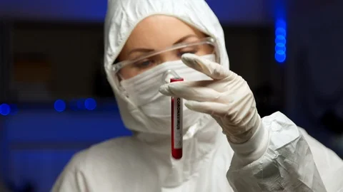 Scientist testing sample for Coronavirus Stock Footage 127560502