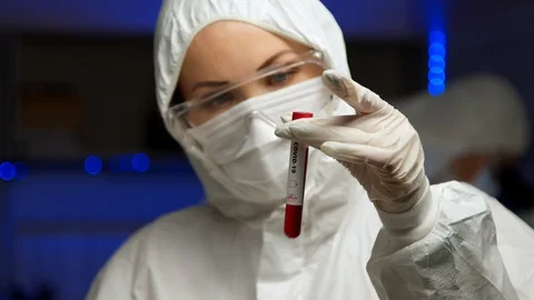 Scientist testing sample for COVID-19 Video stock 127560590