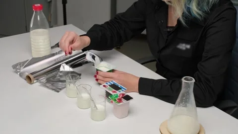 Scientist Testing Yogurt Samples in Laboratory Stock Footage 303370703