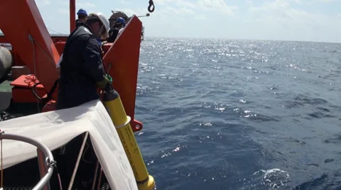 Scientist throwing the Argo buoy Stock Footage 36441779