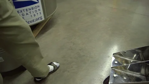 Scientist throwing liquid nitrogen on floor in laboratory Stock-Footage 93518003