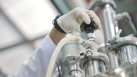 Scientist turn off valve of laboratory machine close up Stock Footage 158913532