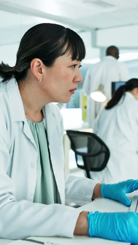 Scientist, typing and woman with computer in lab, serious and medical research Stock Footage 333167758