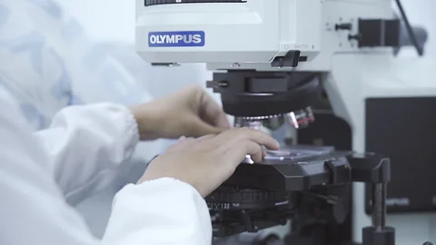 Scientist use microscope close up Laboratory 50fps Stock Footage 247403927