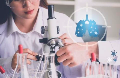 Scientist use microscope in the laboratory for research anti virus or vaccine of Stock Photos