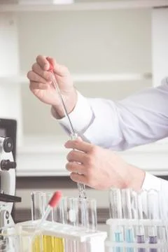 Scientist use microscope in the laboratory for research anti virus or vaccine of Stock Photos